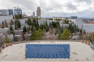 View of pool featuring a view of city and a patio area