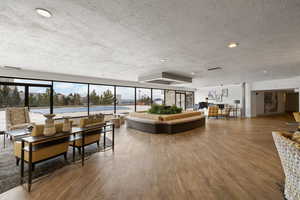 Community lobby with a textured ceiling and recessed lighting