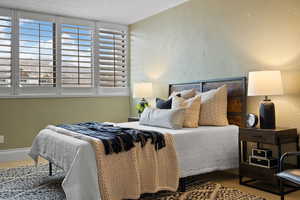 Bedroom with a textured wall