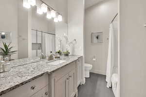 Full bathroom with vanity and shower / bath combo with shower curtain