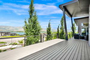 Deck featuring a water and mountain view