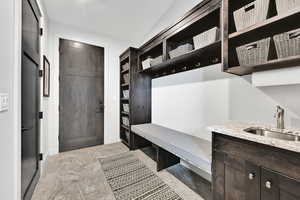 Mudroom featuring a sink