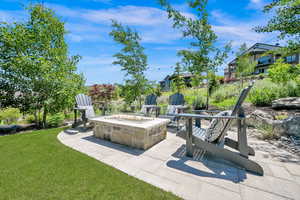 View of patio featuring an outdoor fire pit
