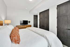 Bedroom featuring multiple closets