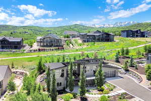 Aerial view of residential area featuring a mountainous background