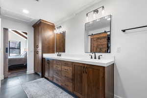 Ensuite bathroom featuring double vanity and recessed lighting
