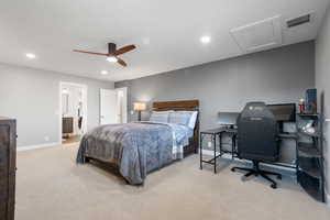 Bedroom 2, with attic access, light colored carpet, an office area, recessed lighting, and ceiling fan