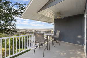 Balcony featuring a ceiling fan