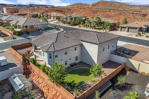 Aerial perspective of suburban area featuring a mountainous background