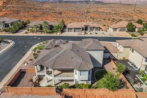 Aerial view of property and surrounding area featuring mountains