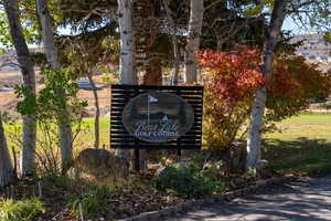 Community / neighborhood sign with a yard