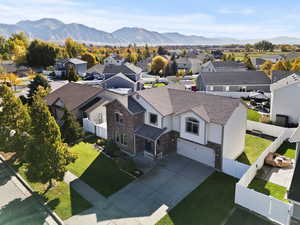 Aerial perspective of suburban area with a mountainous background