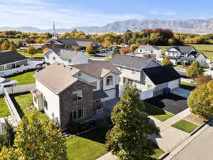 Aerial perspective of suburban area featuring a mountainous background