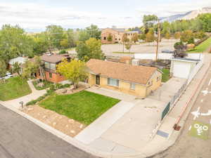 Aerial perspective of suburban area with a mountain backdrop