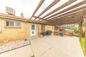 View of patio featuring area for grilling