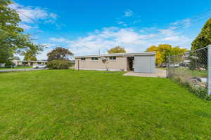 Back of house with brick siding and a patio