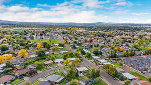 Aerial perspective of suburban area with a mountain backdrop