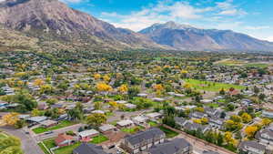 Aerial perspective of suburban area with a mountainous background