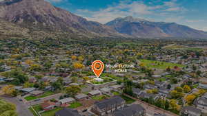 View of property location with nearby suburban area and mountains