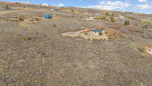 Aerial view of property and surrounding area featuring rural landscape