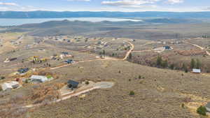 Aerial overview of property's location with a view including the mountains and the lake.