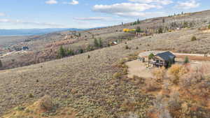 View of subject property with a mountain backdrop