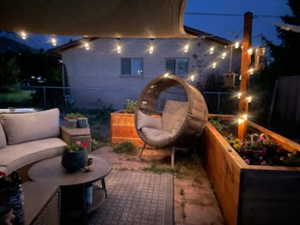 Patio at twilight with outdoor lounge area and a patio area