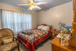 Bedroom featuring carpet and a ceiling fan