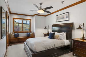 Bedroom with light colored carpet, a ceiling fan, crown molding, and recessed lighting