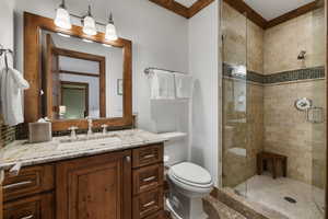 Bathroom with a shower stall and vanity
