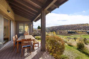 Wooden terrace with outdoor dining space