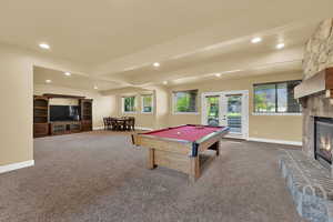 Rec room with french doors, beam ceiling, healthy amount of natural light, carpet floors, and recessed lighting