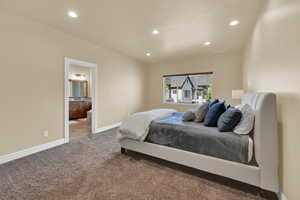 Carpeted bedroom featuring recessed lighting and connected bathroom