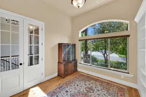 Entryway with light wood finished floors and baseboards