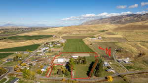 View of rural area with a mountain backdrop and property boundaries highlighted