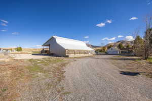 View of barn #2 with a mountain view and driveway