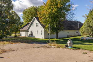 View of property exterior featuring a yard