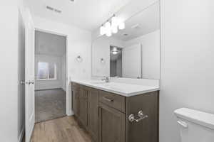 Bathroom featuring light wood finished floors and vanity