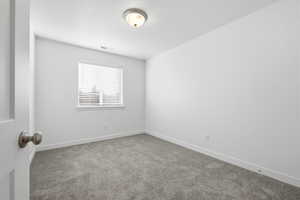 Empty room with carpet floors
