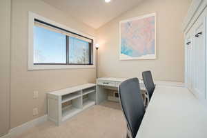 Office area featuring light carpet, lofted ceiling, and recessed lighting