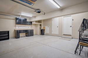 Garage featuring a garage door opener