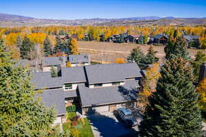 Aerial view of residential area featuring a mountainous background