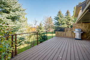 Wooden deck featuring grilling area