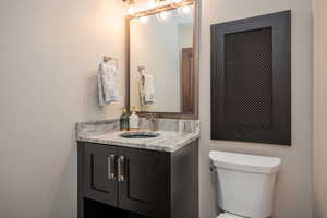 Powder room with vanity and toilet