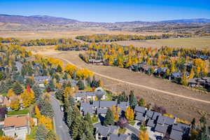 View of property location with mountains and nearby suburban area