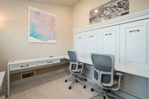 Office area featuring light colored carpet