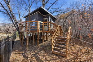 View of play area featuring a deck and stairway