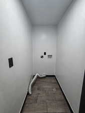 Laundry room featuring washer hookup, hookup for an electric dryer, and dark wood finished floors