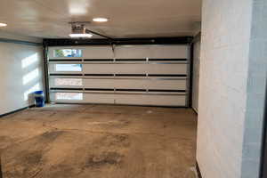 Garage featuring a garage door opener
