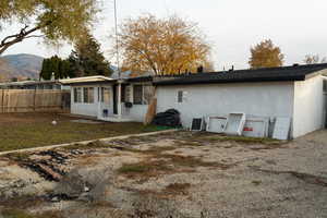 Back of house with stucco siding